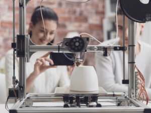 Freelance 3D printing service provider setting up a 3D printer